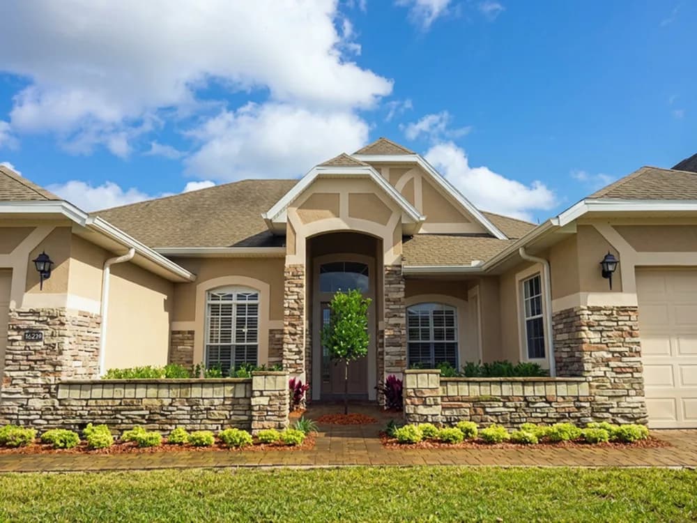 Ranch home with manicured foundation plantings